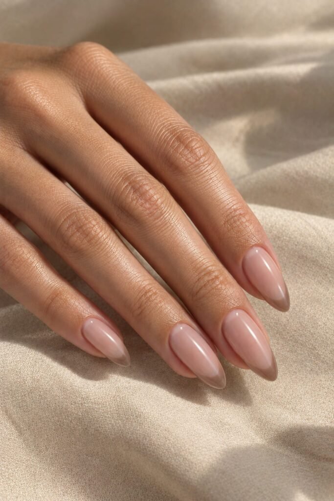 Almond foggy French nails with sheer beige base and muted mocha tips