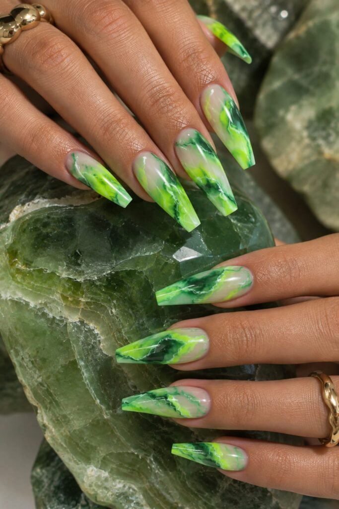 Fluorescent green marble nails with lime and emerald swirls on ballerina nails.