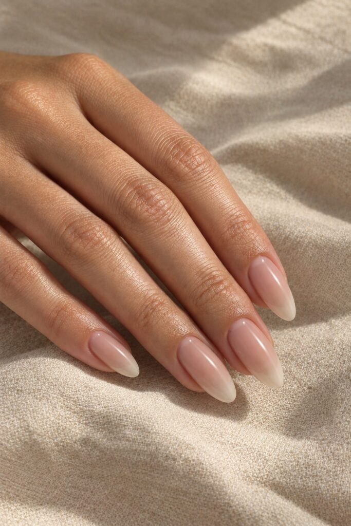  Long oval beige foggy French nails with a softly veiled finish