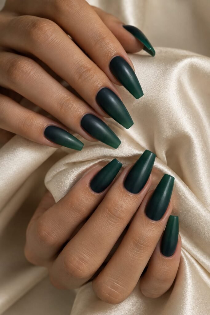 Medium ballerina nails with a smooth dark teal to deep green satin ombre.