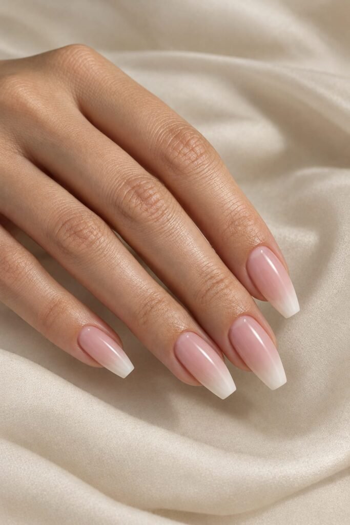 Medium coffin foggy French nails with a pink-to-cream diffused gradient