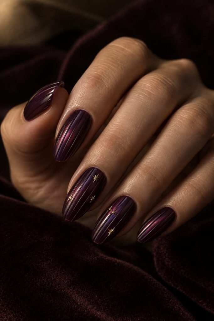 Plum ribbed glass nails with delicate gold star accents