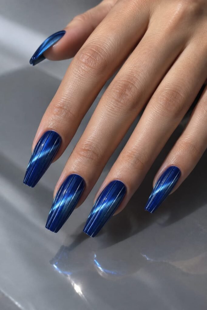 Sapphire blue magnetic ribbed glass nails with silver cat-eye shimmer
