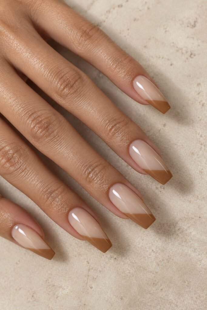 Tapered-square beige nails with angled caramel French tips